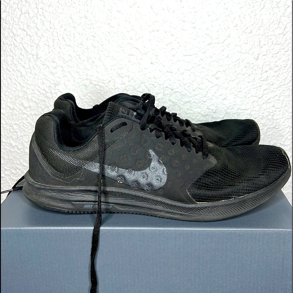 Black Nike athletic shoe
